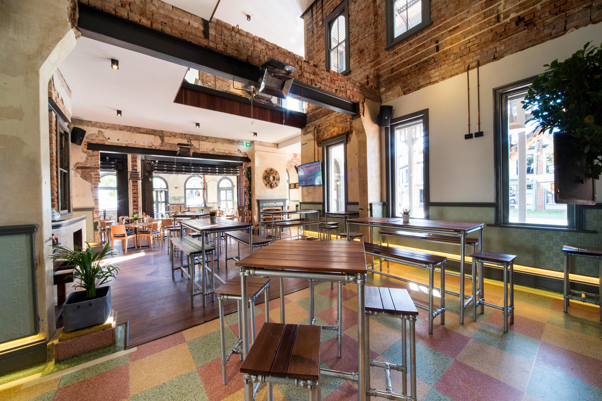 The Guildford Hotel heritage dining room with restored brick walls, timber and linoleum floors