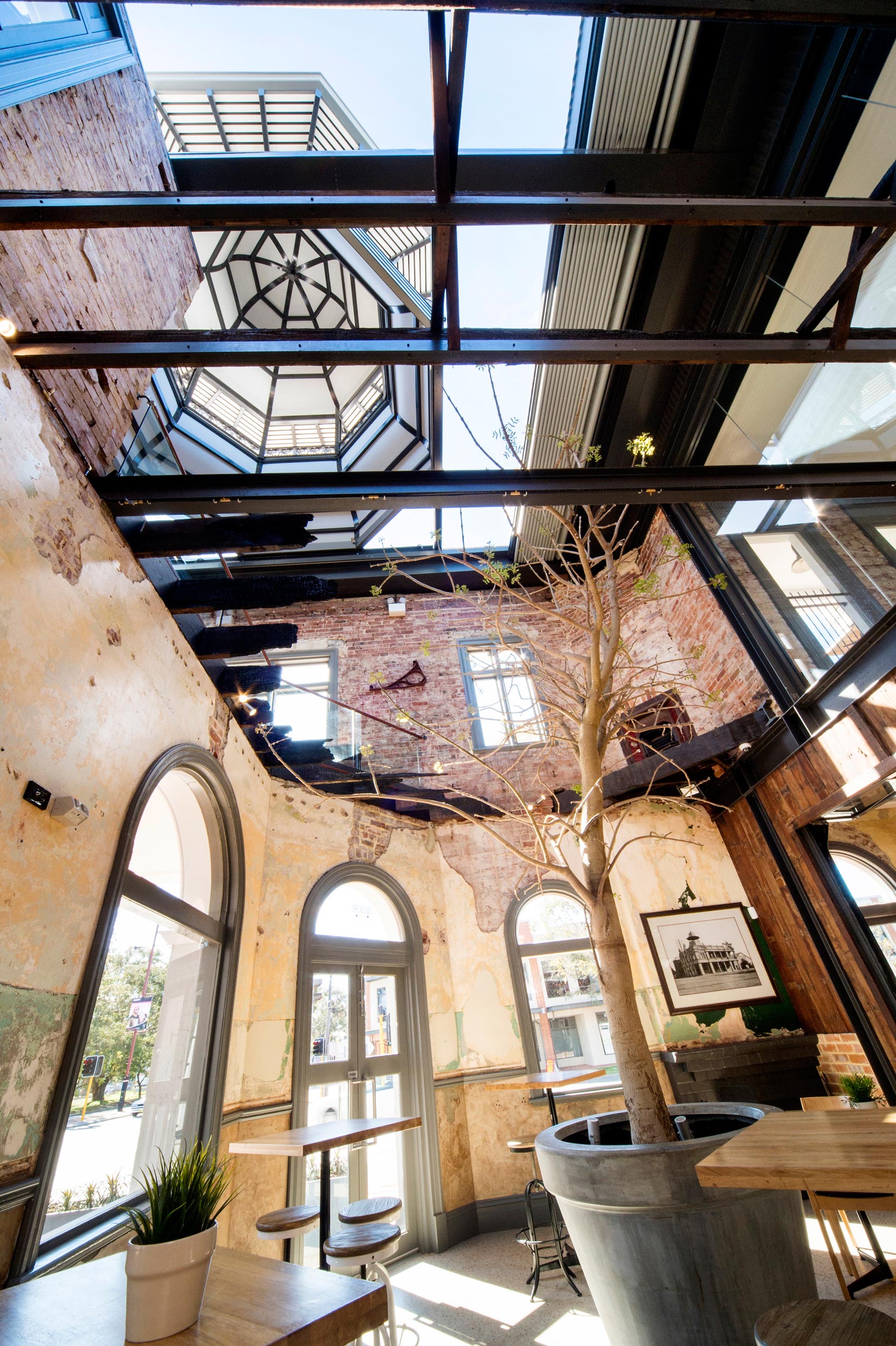 The Guildford Hotel heritage dining room with restored brick walls, steel beams and belvedere over open roof