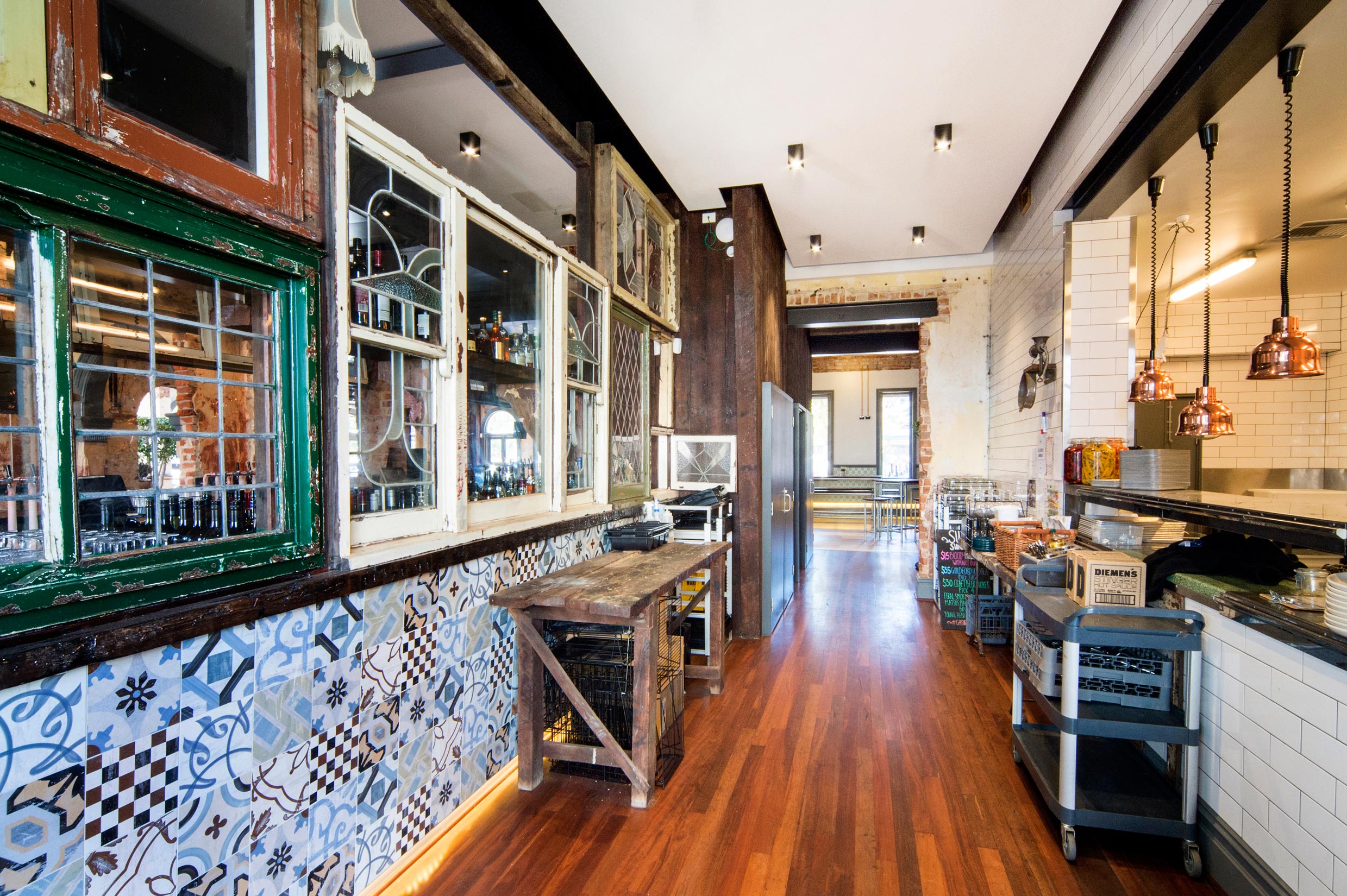 The Guildford Hotel heritage kitchen with timber floors, tiled walls and heritage windows