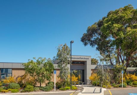 Burswood Park Board Administration Building grey and timber exterior with lush garden