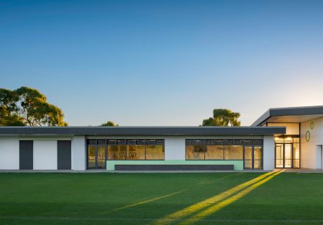 Carine Hall Recreation Centre with angled walls and sunlight streaming through entrance onto sporting fields