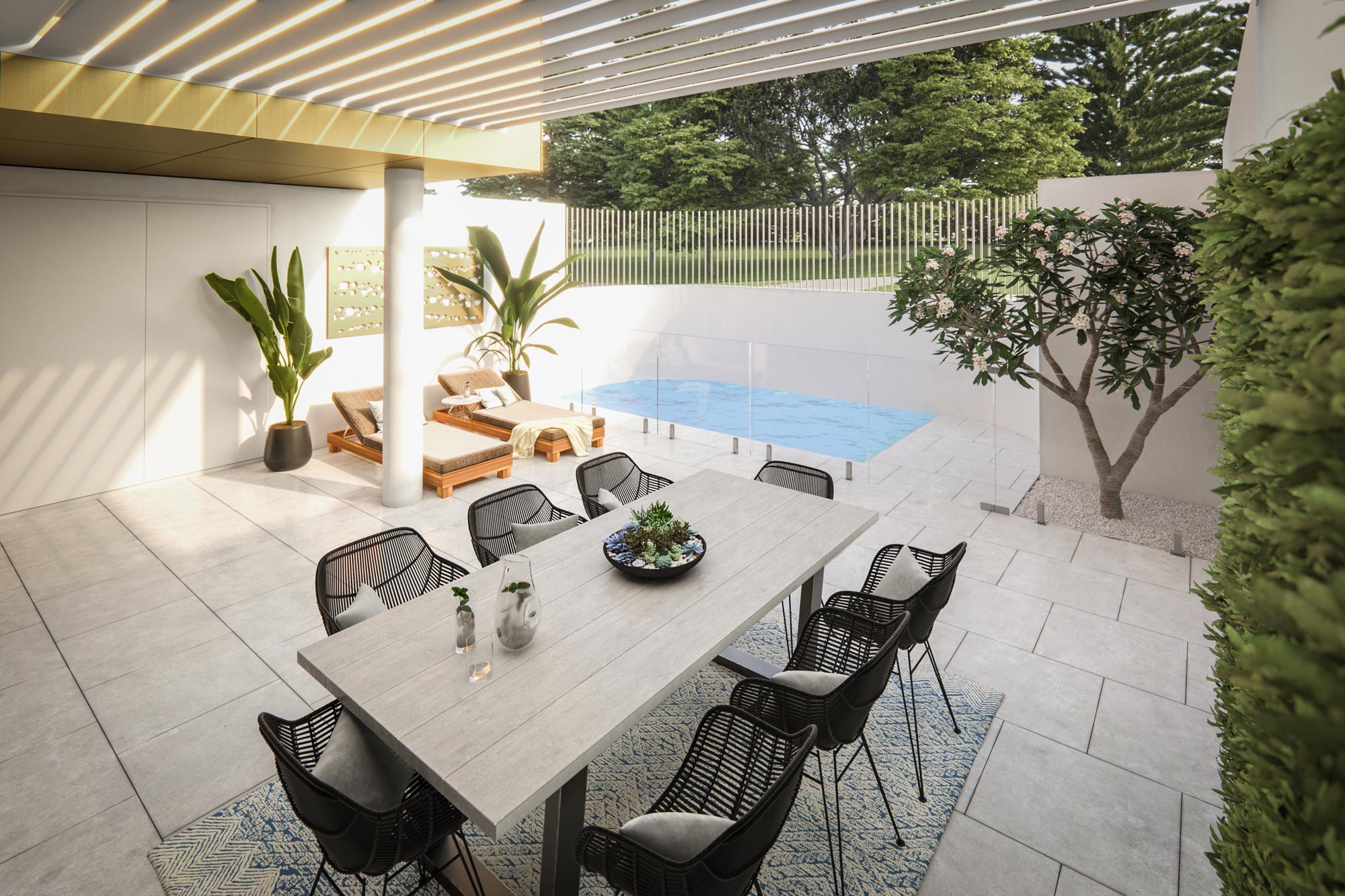 Covered alfresco area with pool, dining table, paving and side garden at Elizabeth Residences Cottesloe Apartments